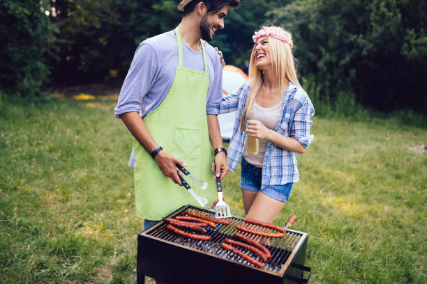 istock Beautiful woman and handsome man having barbecue 1139931047