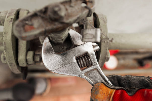 istock The technician with a wrench wrench turns the nut at the measuring device. 1139932339