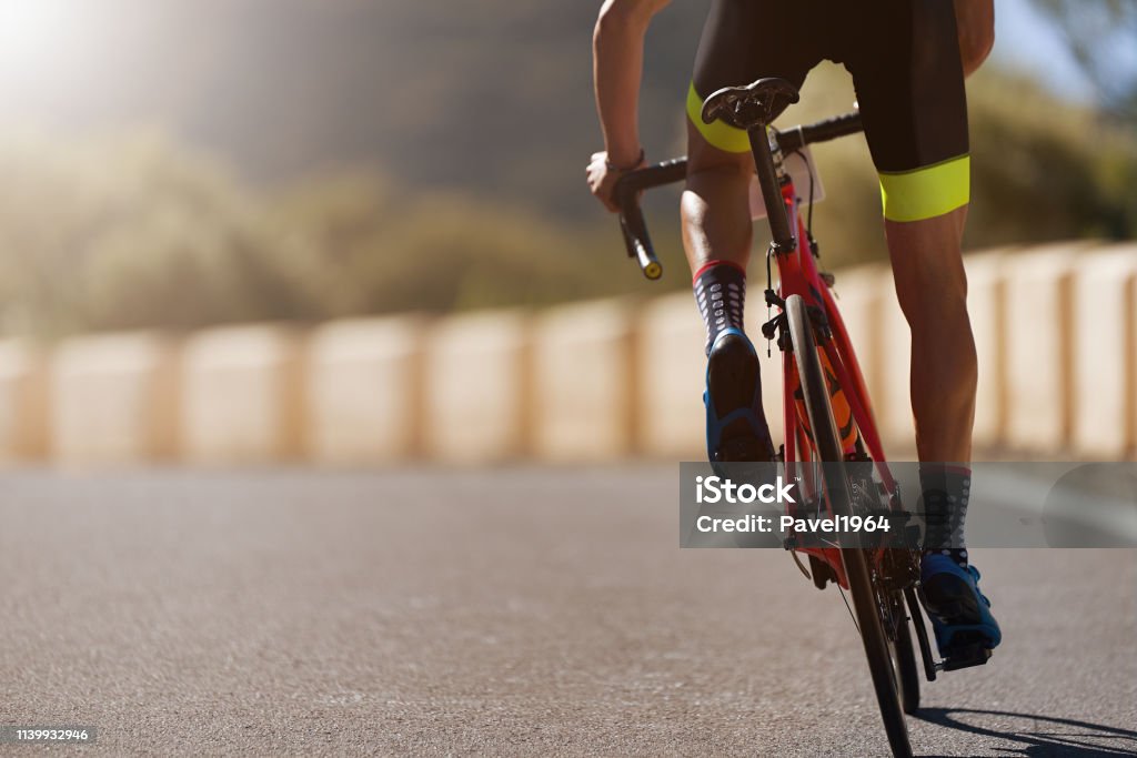 Road bike cyclist man cycling Road bike cyclist man cycling, athlete on a race cycle Cycling Stock Photo