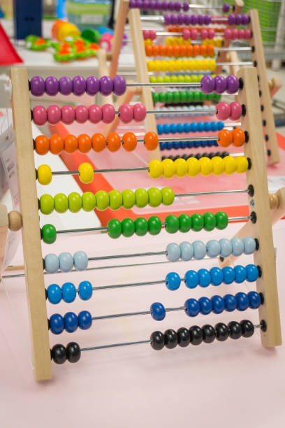 istock children's abacus on the table. Children's room, game, training 1139934405