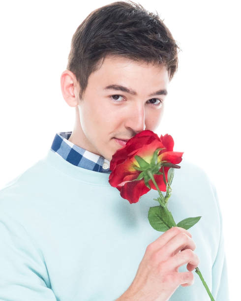 istock Attractive man is holding a red rose 1139939774