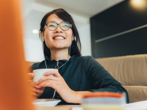 istock Young Asian woman working at alternative work space 1139940825