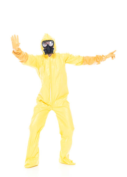 istock Man in protective clothing holding hands out in a stop gesture 1139940896