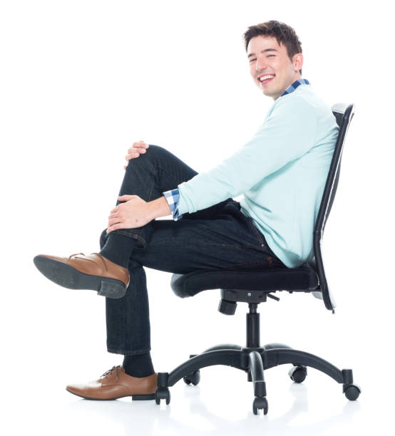 istock Handsome young man sitting and and being happy, side view 1139941087