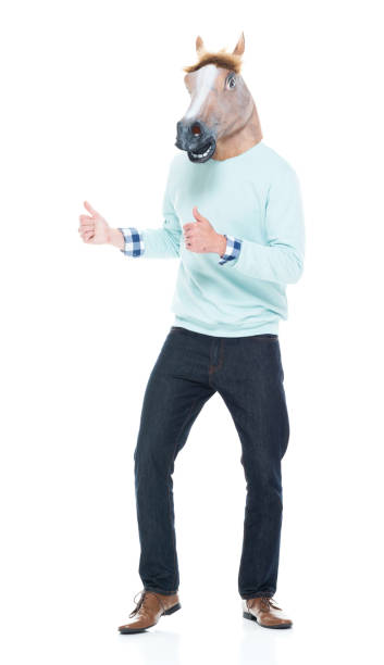 istock Man with horse mask and dancing 1139941166