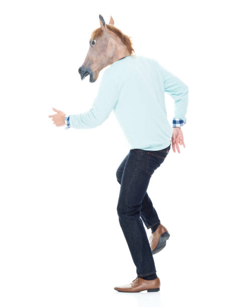 istock Man with horse mask is dancing 1139941557
