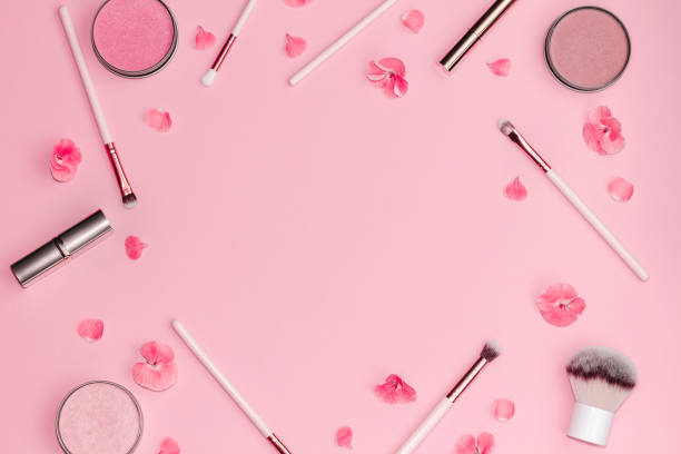 istock Flat lay composition with decorative makeup products and pink flowers on pastel pink background. 1139942530