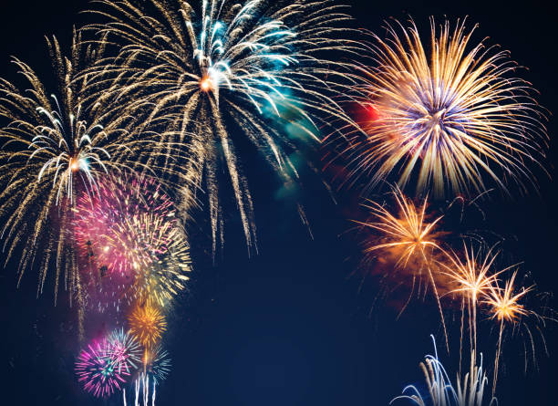 istock colorful fireworks on the black sky background with free space for text. Celebration and anniversary concept 1139942925