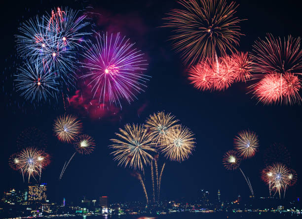 istock colorful fireworks on the black sky background with free space for text. Celebration and anniversary concept 1139942928