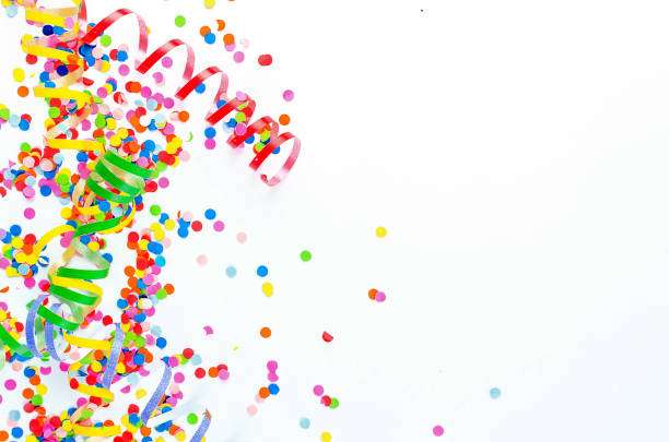 istock Colorful assorted confetti with serpentine on white 1139943640
