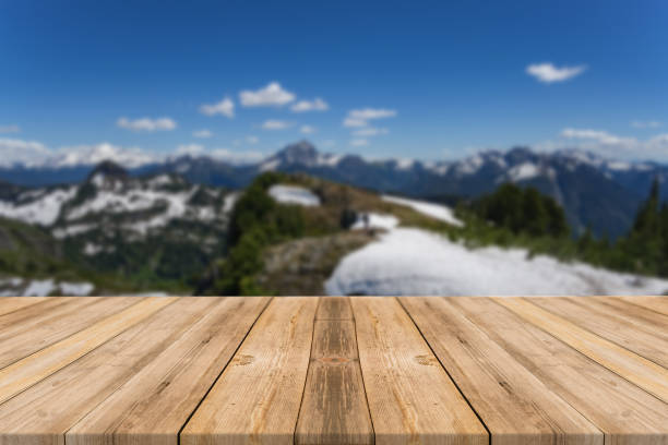 istock Empty wooden desk of free space and spring time with blurred background. 1139944181