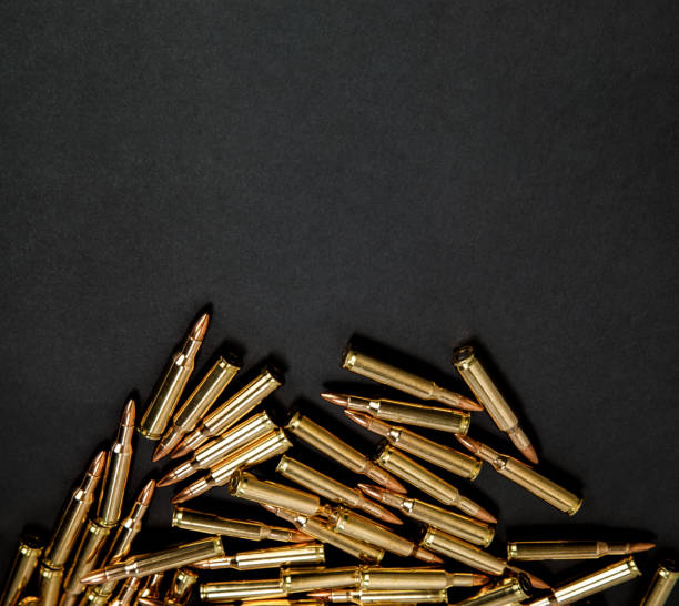 istock Rifle cartridges on a black background 1139944228
