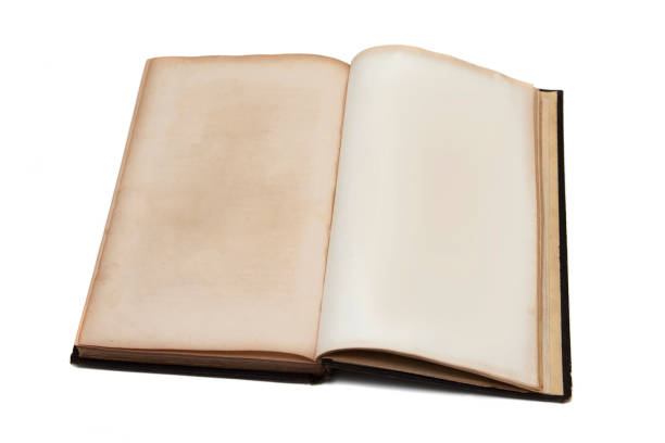 istock Old vintage book with yellowed aged pages isolated on white background.  Open book mockup 1139944472