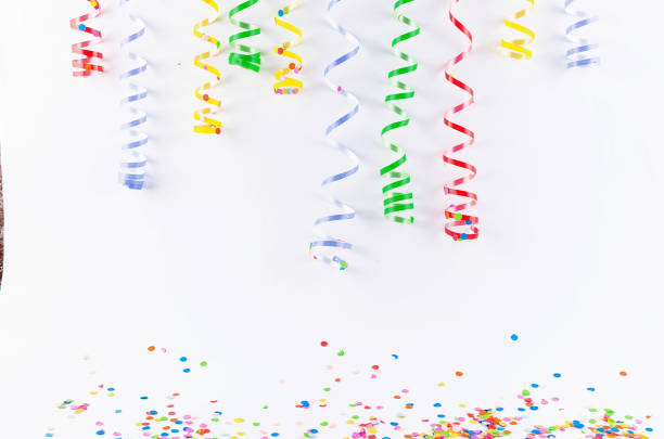 istock Colorful assorted confetti with serpentine on white 1139944483