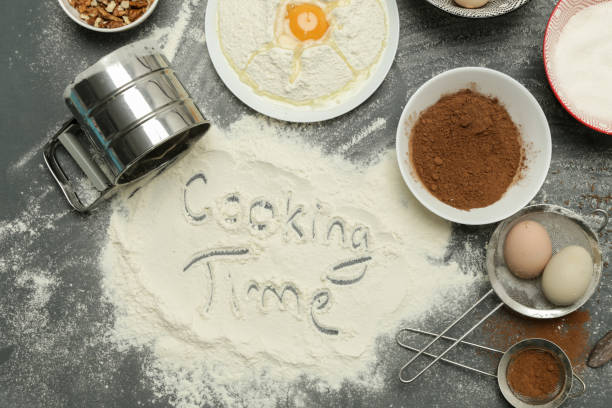 istock Creating a recipe, Top view of the basic baking ingredients and kitchen utensils on the dark background, cooking concept 1139944652