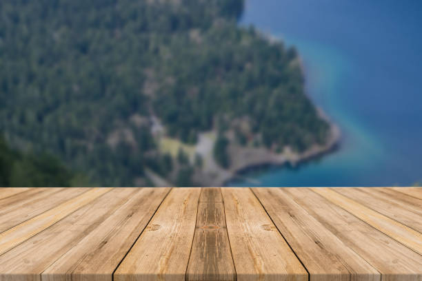 istock Empty wooden desk of free space and spring time with blurred background. 1139944822