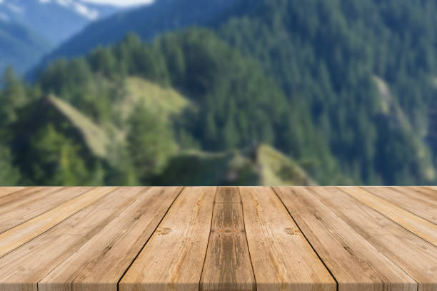 istock Empty wooden desk of free space and spring time with blurred background. 1139944824