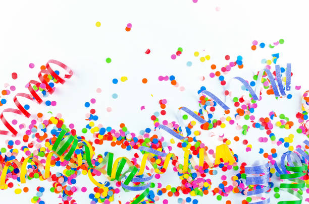 istock Colorful assorted confetti with serpentine on white 1139944874