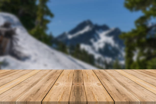 istock Empty wooden desk of free space and spring time with blurred background. 1139946347
