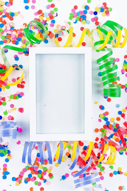 istock Colorful assorted confetti with serpentine on white 1139947522