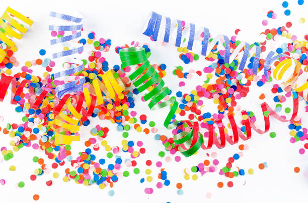 istock Colorful assorted confetti with serpentine on white 1139948213