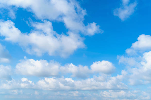 istock Clear blue sky with white fluffy clouds. Nature background 1139949758