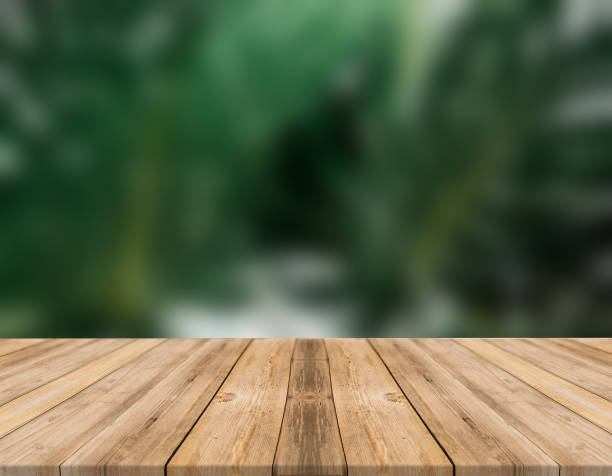 istock Empty wooden desk of free space and spring time with blurred background. 1139950462