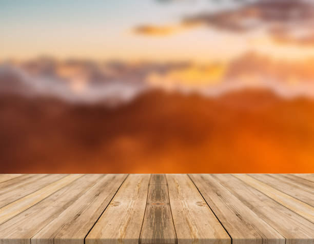 istock Empty wooden desk of free space and spring time with blurred background. 1139951110
