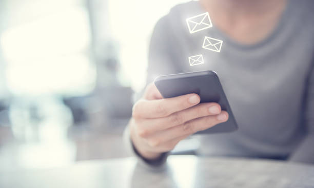 istock Closeup Woman hand using mobile smartphone with email icon, Email concept. 1139952723