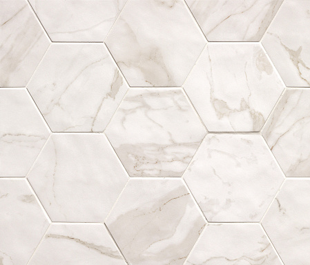 Light beige hexagonal marble mosaic tiles texture background. Marble tiles with natural pattern.