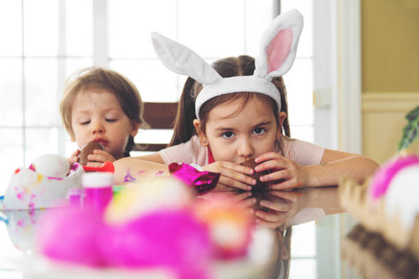 istock Sister and brother eating chocolate 1139953429