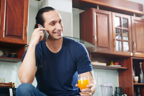 istock Happy man talking on the phone 1139955097