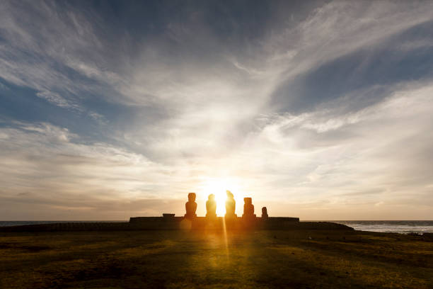 The sunsets on Easter Island, silhouetting the iconic Moai of Ahu Ko Te Riku, just to the north of the capital of Hanga Roa.The Moai were constructed around five or six hundred years ago and represent the islanders' ancestors. They were all toppled after a period of tribal warfare broke out, though a number were restored in the twentieth century.