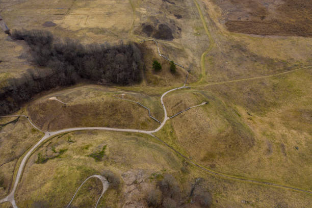 istock Aerial view of hills with twisted pathways on sunny evening day. 1139957059