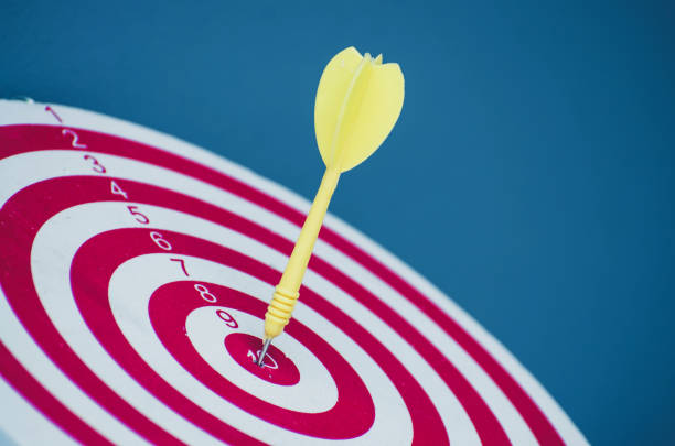 istock target dart pin on center 10 point dartboard  Marketing concept. 1139957570