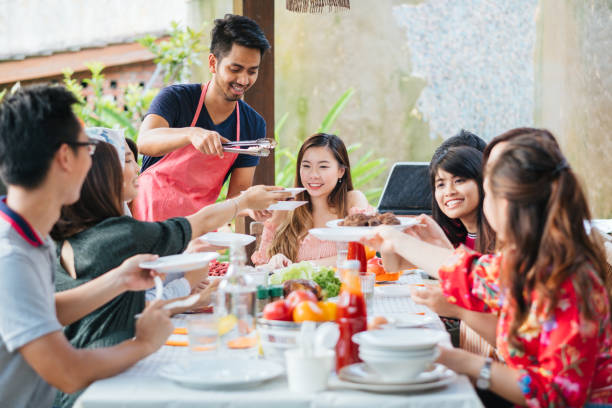 istock Group of Friends Having Meal Together 1139959542