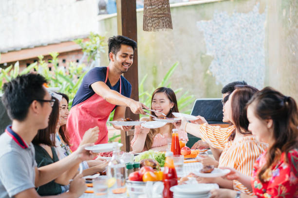 istock Group of Friends Having Meal Together 1139959566