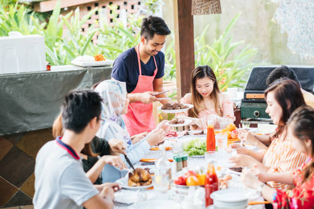 istock Group of Friends Having Meal Together 1139959584