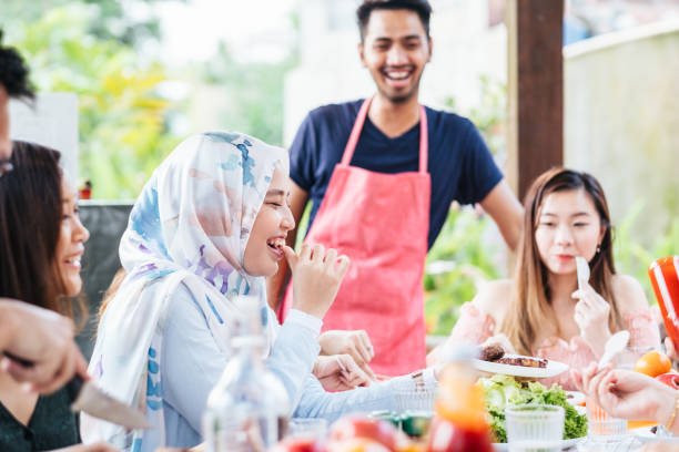 istock Group of Friends Having Meal Together 1139959592