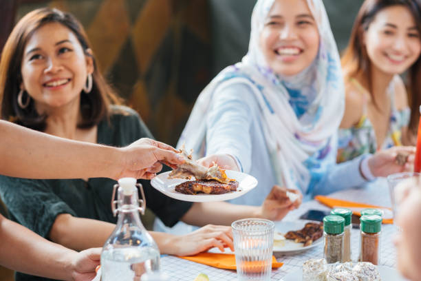 istock Group of Friends Having Meal Together 1139959600
