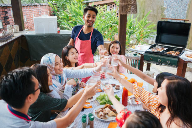 istock Group of Friends Toasting During Barbecue Party 1139959640