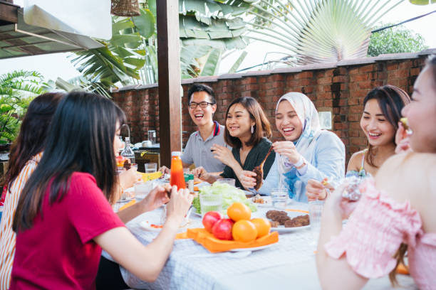 istock Group of Friends Having Meal Together 1139959671
