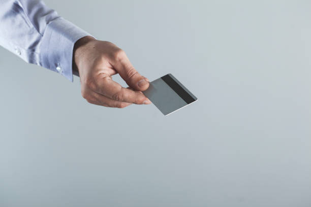 istock man hand credit card 1139961146