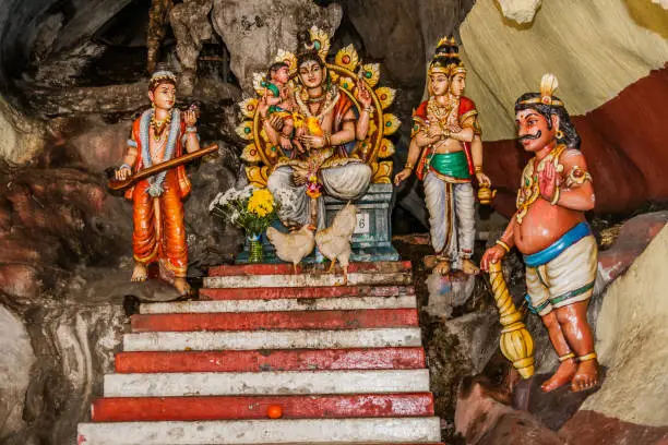 Batu Caves is a limestone hill that has a series of caves and cave temples in Gombak, Selangor, Malaysia. It takes its name from the Sungai Batu, which flows past the hill.