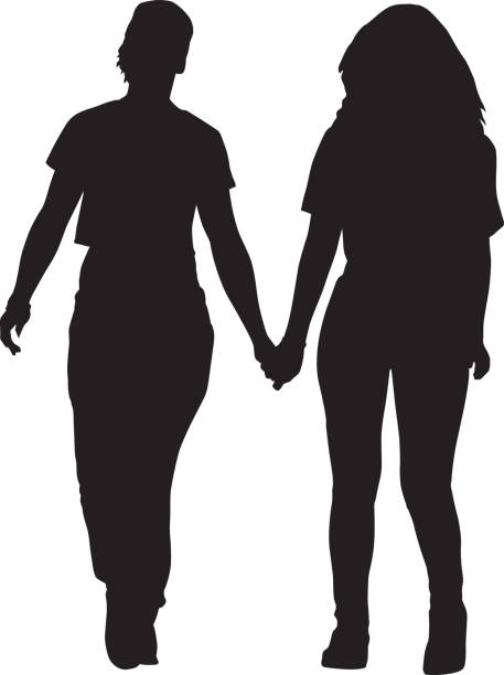 Two Young Women Walking Holding Hands Silhouette Vector silhouette of two youg women walking toether holding hands. gay long hair stock illustrations