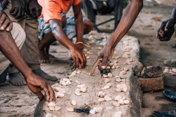 istock Hands playing Mancala game which is very popular in Africa 1139972638