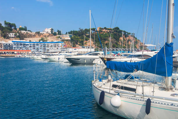 White yachts in blue marina bay, Blanes, Costa Brava, Spain