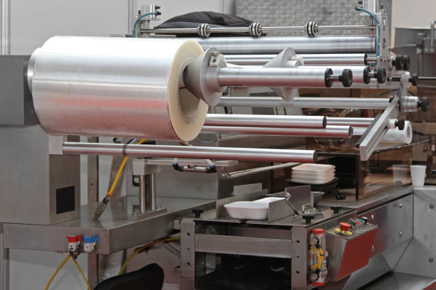 food packaging machine - manufaturing imagens e fotografias de stock