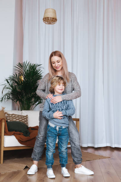 istock Happy mother posing with her son at home 1139987299