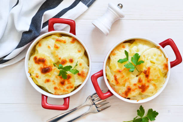 istock Potato casserole with bechemel sauce and cheese on the kitchen table. Top view. 1139994503